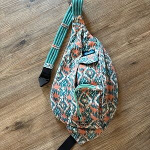 Kavu Patterned Sling Bag in Teal and Orange